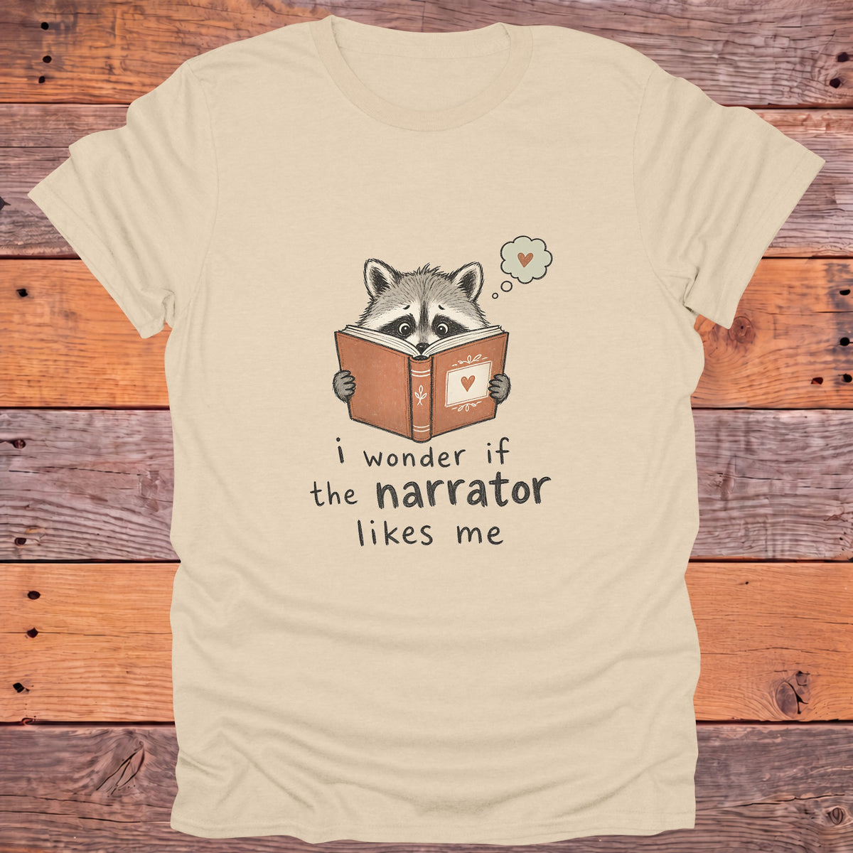 I Wonder If the Narrator Likes Me Raccoon Bookish T-Shirt - Sand
