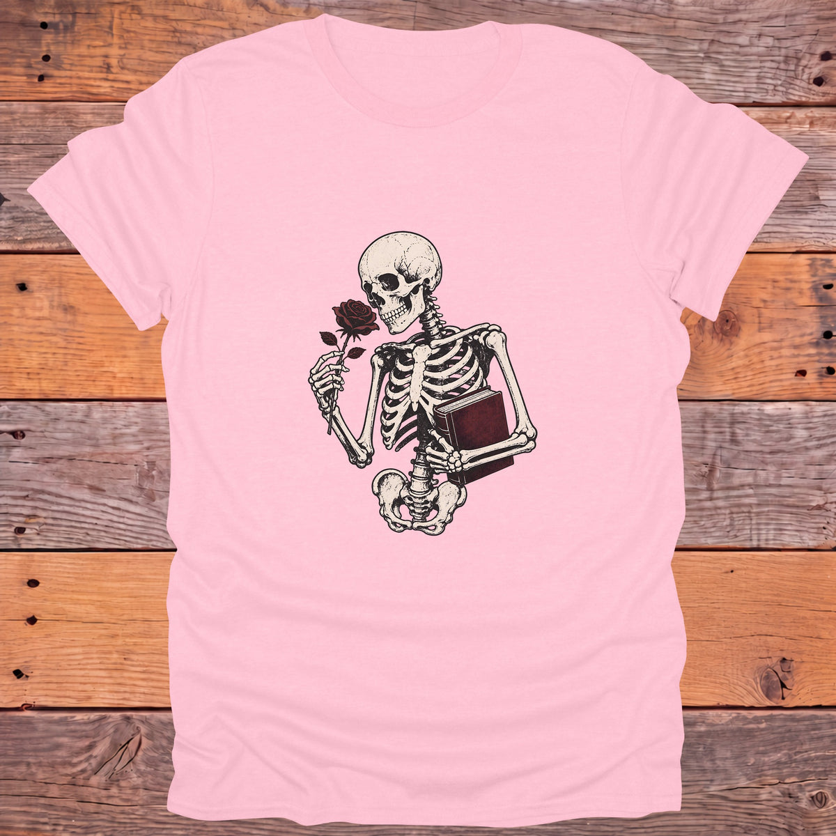 Skeleton Holding Rose and Book Gothic Bookish T-Shirt - Light Pink